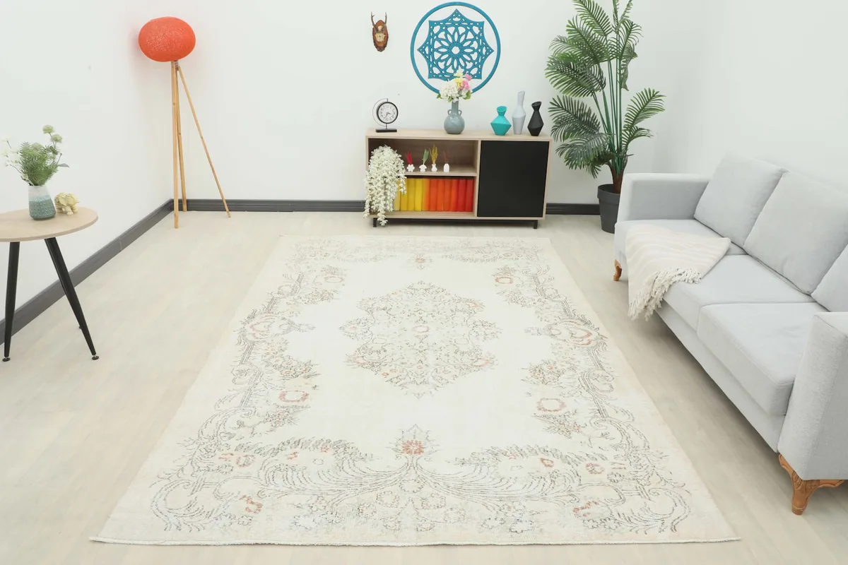 Full room view of the ivory floral medallion rug, providing a comprehensive sense of its presence.