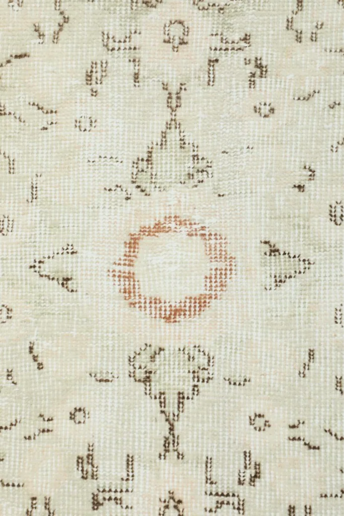 Underside view of the hand-knotted cotton foundation, revealing the rug's construction.