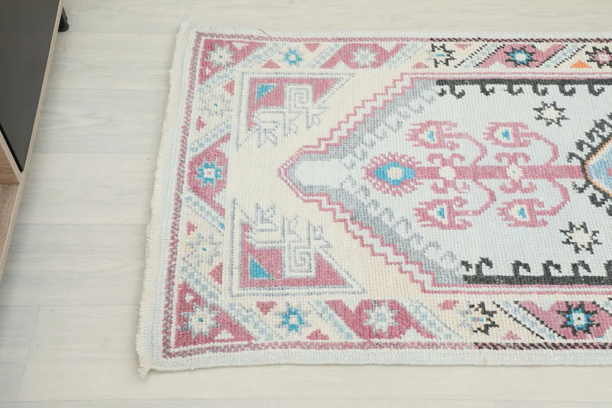 Close-up of the opposite end of the runner, showcasing the intricate tribal motifs and color variations.