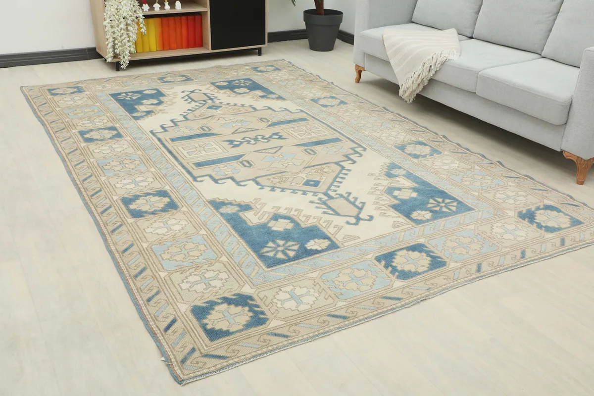 Angle view of the large hand-knotted rug showing its colors and placement in a room.