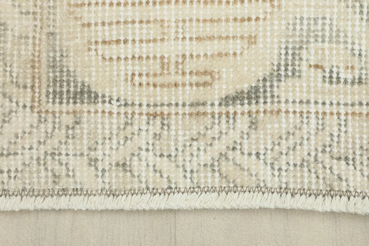 Close-up of the low wool pile and hand-knotted texture of the vintage Anatolian rug.