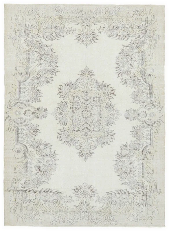 Top view of the 5'7" x 7'7" ivory and gray vintage Anatolian rug with floral and medallion pattern
