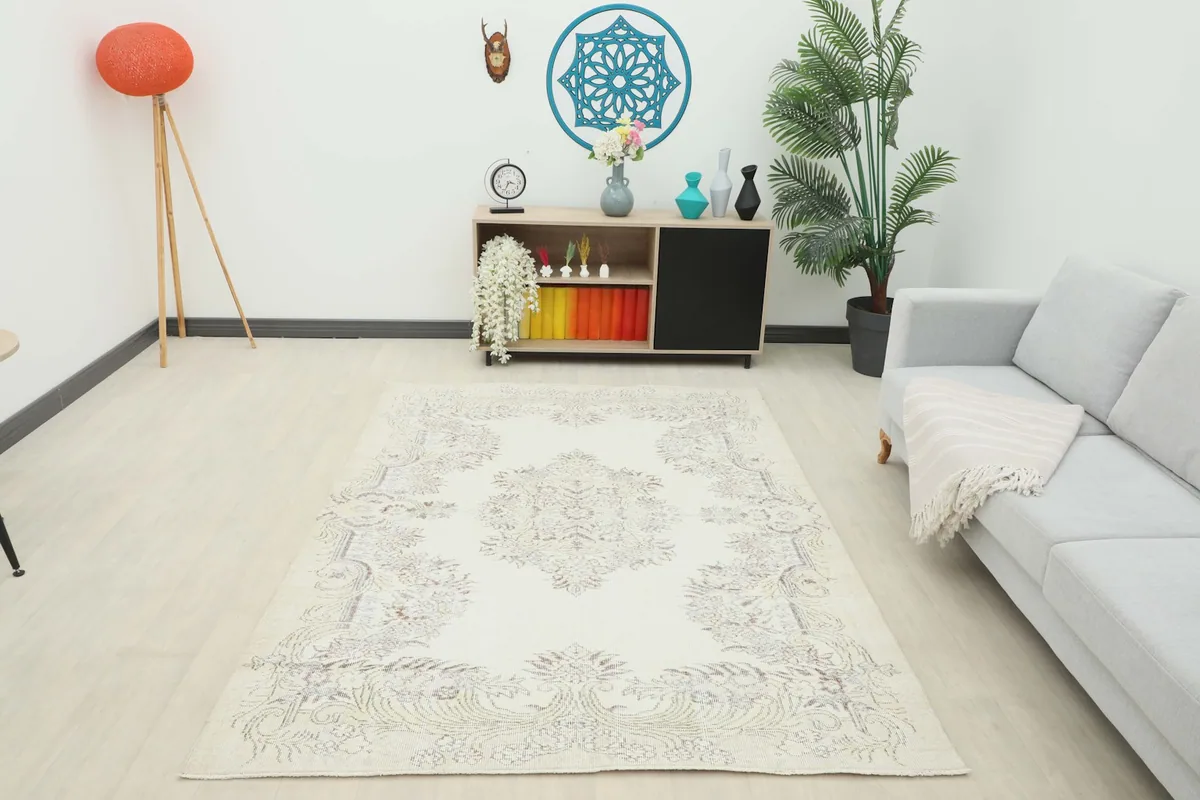 Full room view of the ivory and gray vintage Anatolian rug, providing a sense of its scale and impact