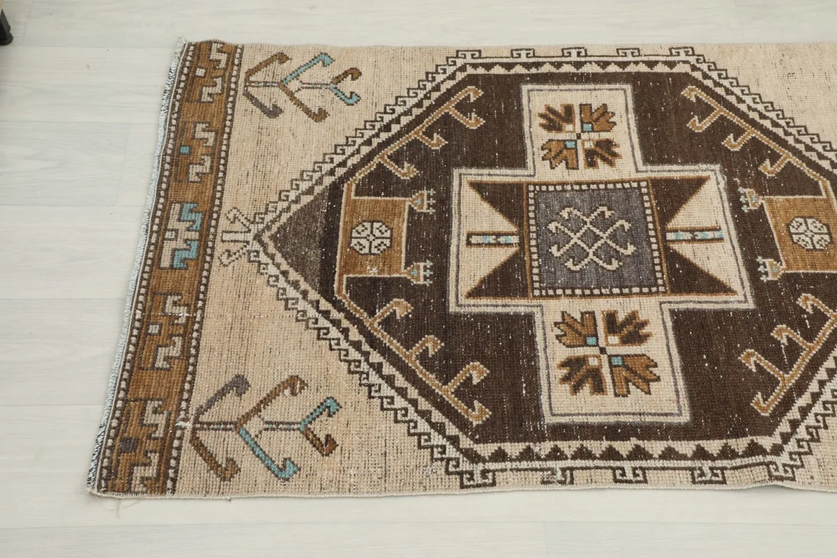 Close-up angle view of the other end of the runner rug, detailing the geometric patterns.