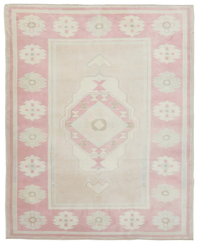 Full overhead view of the beige and pink vintage Anatolian rug