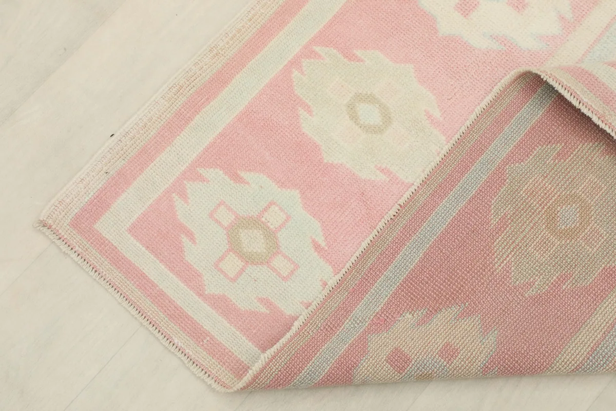 Underside view of the rug, revealing the cotton foundation and tight knotting