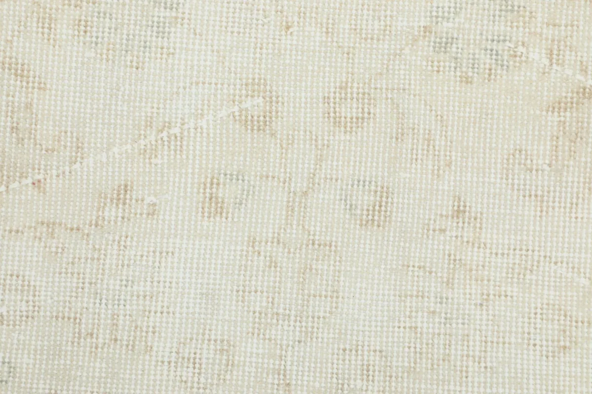 Close-up of the wool pile texture, showing the hand-knotted construction and subtle color variations