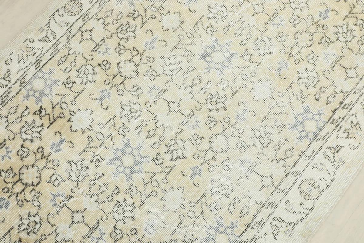 Detailed view of the central field showing the intricate gray and blue motifs