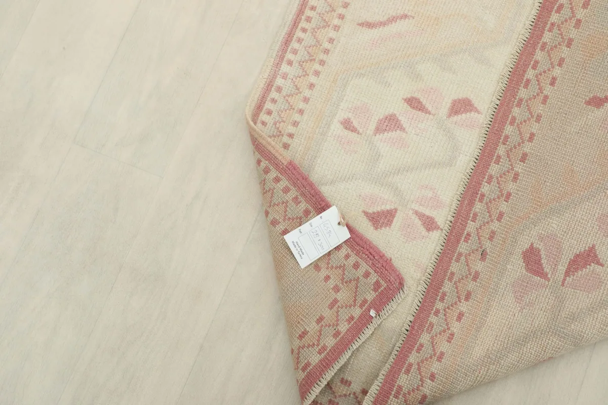 Tag attached to the rug's corner, indicating its origin and material details