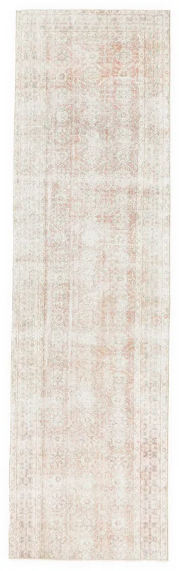 Full top view of the 3'4" x 11'9" vintage Anatolian runner with a soft rose field and floral patterns.