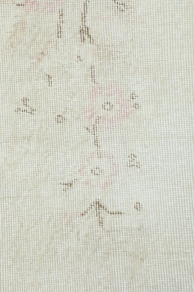Close-up view of the low wool pile and hand-knotted texture