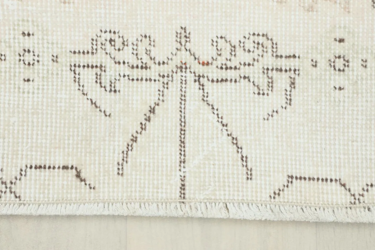 View of the short, natural fringe on one end of the vintage Anatolian runner