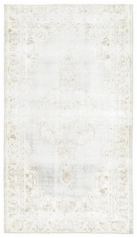 Full top view of the 3'6" x 6'6" vintage blue Anatolian area rug with a central medallion on a white background