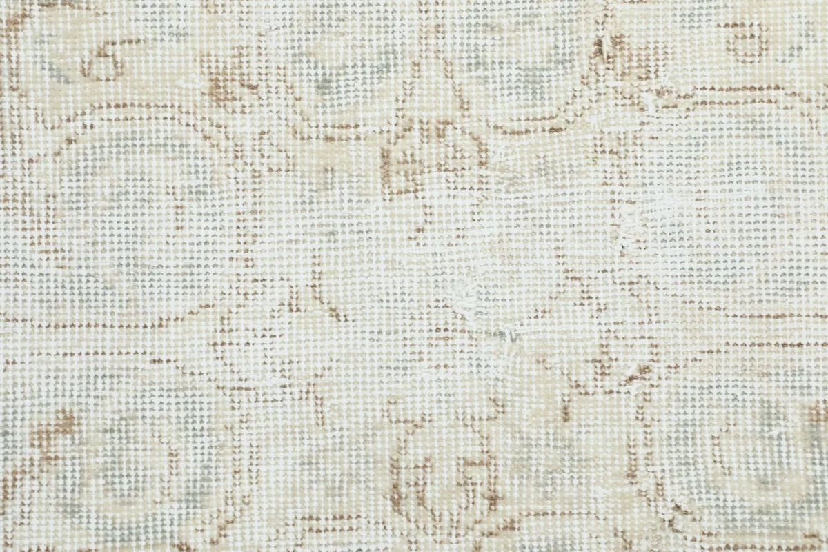 Macro view of the low wool pile and hand-knotted texture of the vintage Anatolian rug