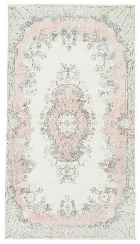 Full top view of the 4x7 ivory and pink floral medallion vintage rug