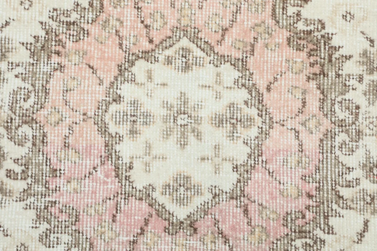 Detailed view of the rug's low wool pile and intricate knotting
