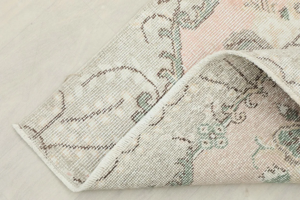 Underside of the rug, showing the cotton foundation and construction
