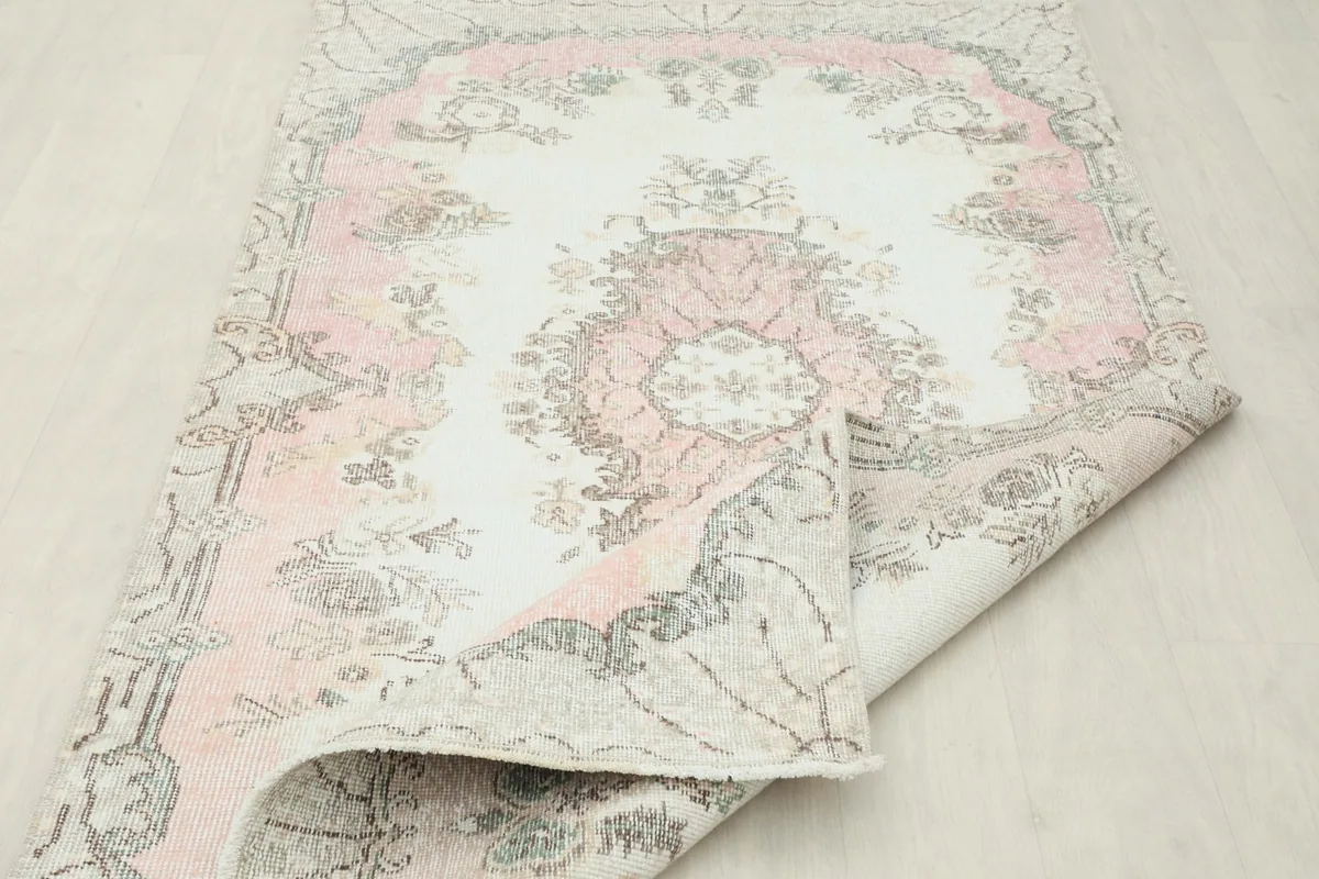 Rug folded to show its flexibility and the reverse side pattern