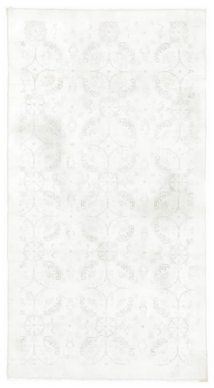 Full overhead view of the 4x7 ivory vintage Anatolian rug with faded floral geometric pattern