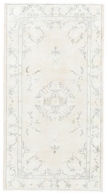 Full top view of the 4x7 cream and gray vintage Anatolian area rug on a white background.