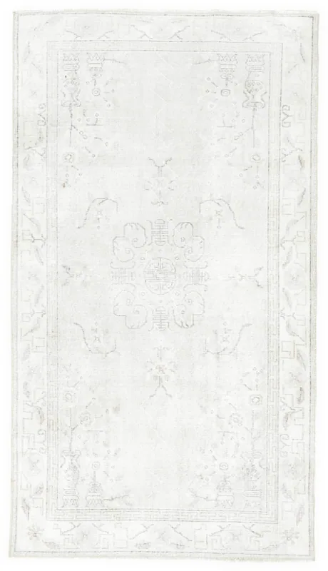 Full overhead view of the 3'8" x 6'9" ivory geometric medallion rug on a white background