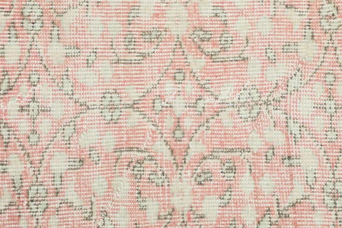 Close-up of the low wool pile, revealing the hand-knotted texture and authentic wear.