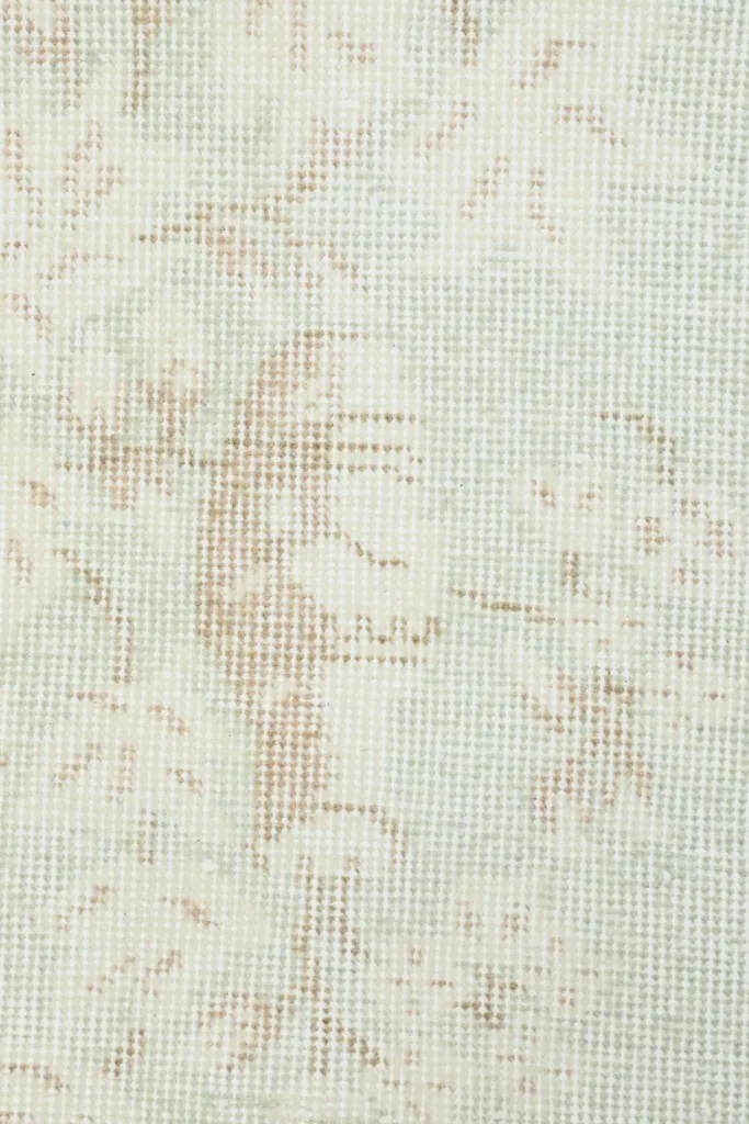Detailed view of the low wool pile and hand-knotted construction of the rug
