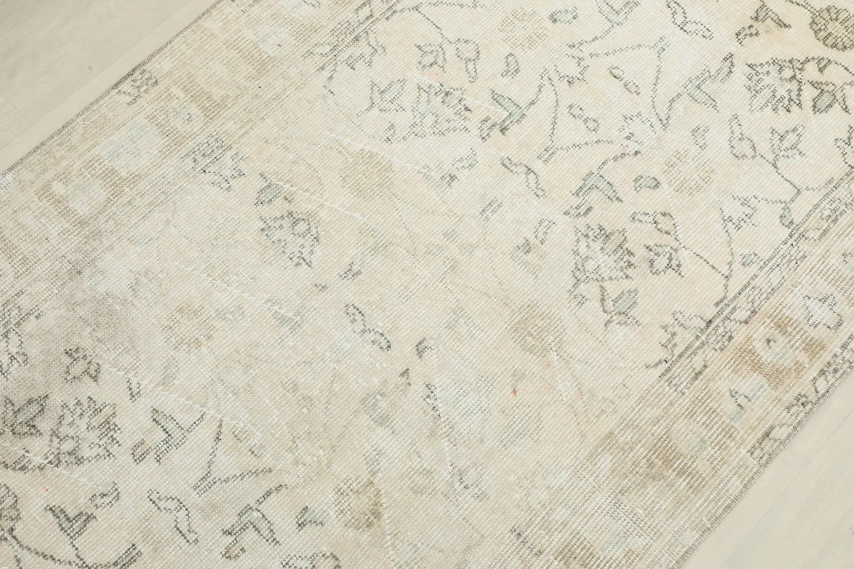 Mid-section detail of the rug, illustrating the gentle distressing and color variations