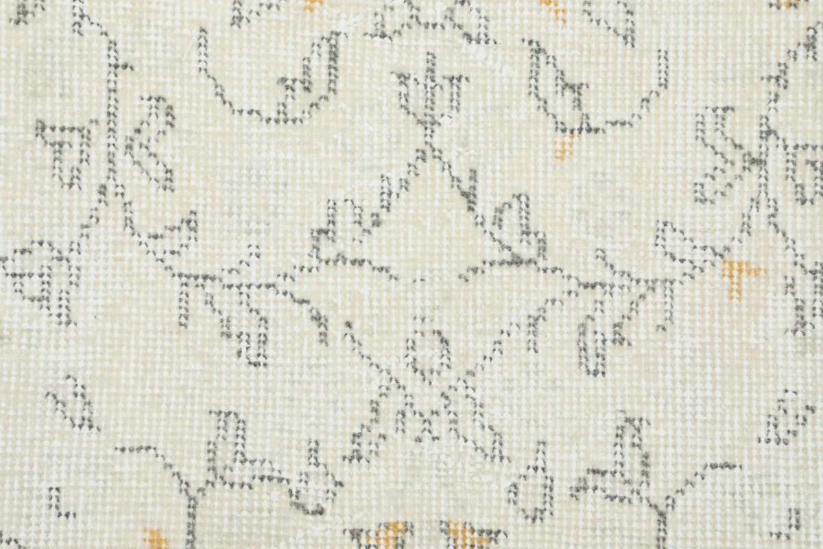 Close-up of the hand-knotted wool pile and subtle color variations