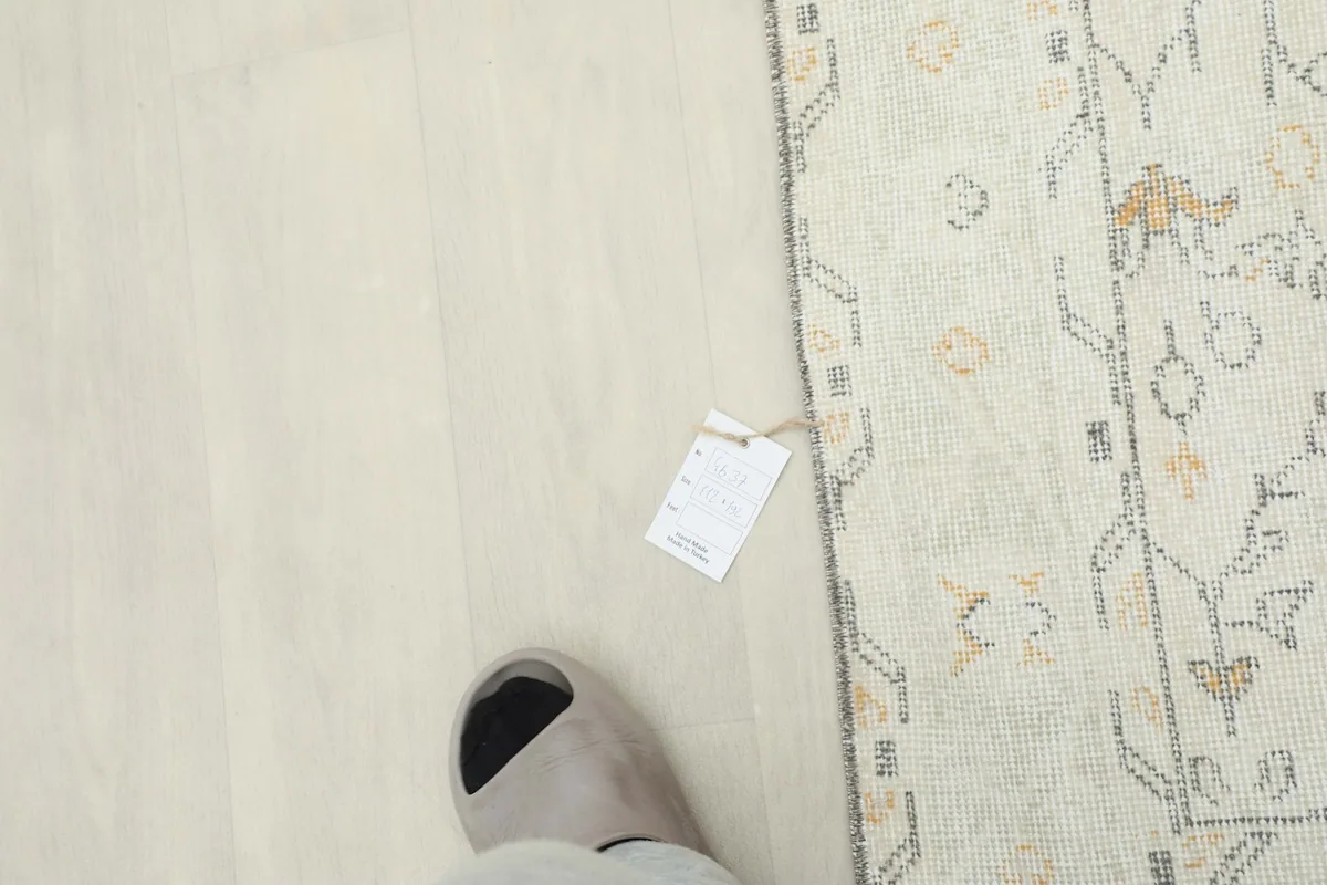 Overhead view showing the rug's texture and a tag for scale
