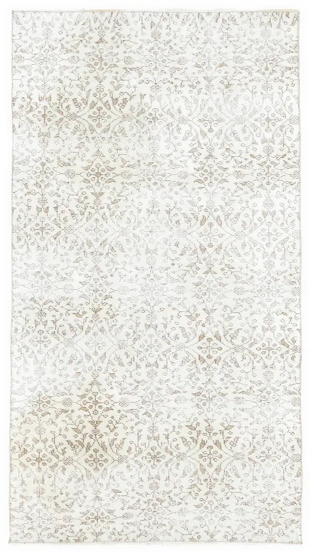 Full top view of the 3'6" x 6'4" cream and beige floral vintage Anatolian rug