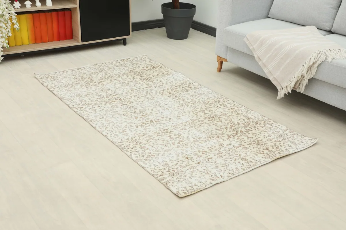 Overhead view of the small area rug in a room, showing its full design