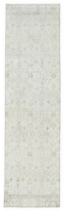 Full top view of the 2'7" x 9'6" ivory floral Anatolian runner rug on a white background