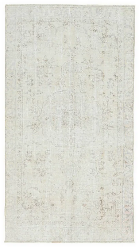 Full overhead view of the ivory and beige vintage Anatolian area rug