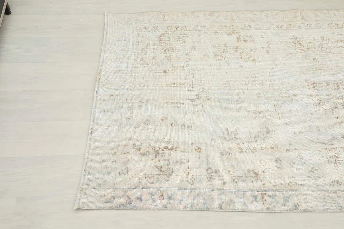 Another angle view highlighting the muted colors and subtle patterns of the rug