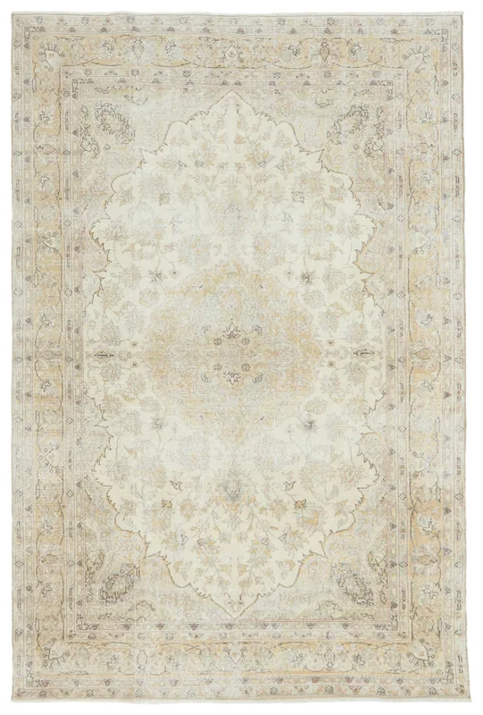 Full top view of a cream and gold vintage Anatolian area rug with a central medallion on a white background.