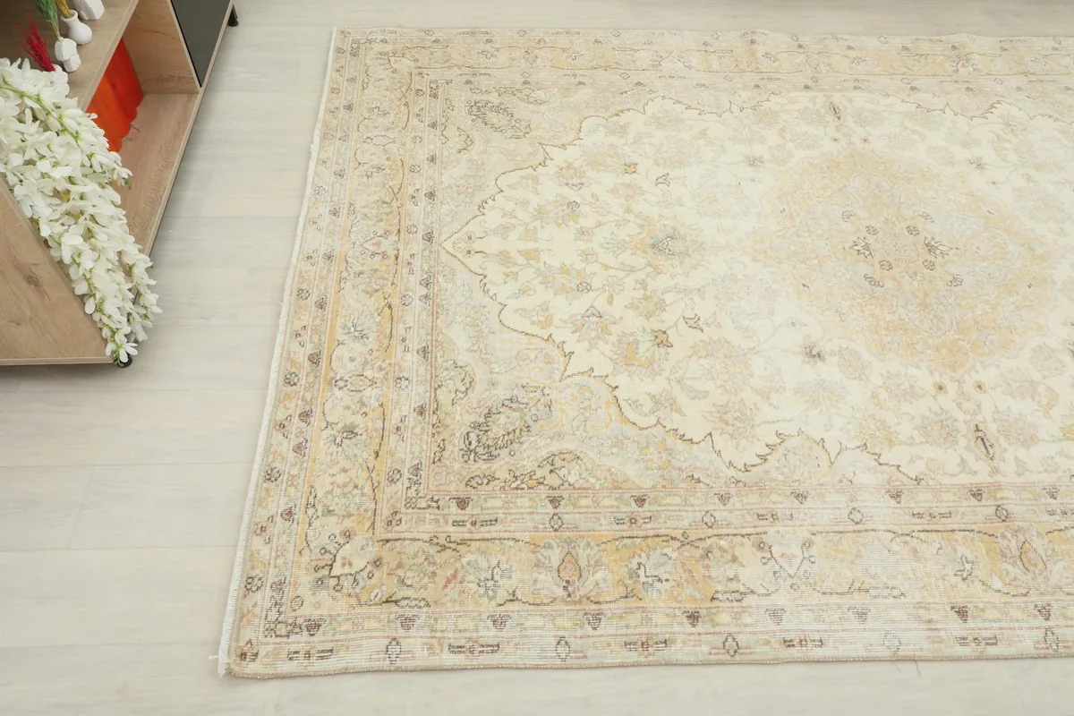 Overhead angle of the vintage Anatolian rug, showing a corner and the surrounding room elements.