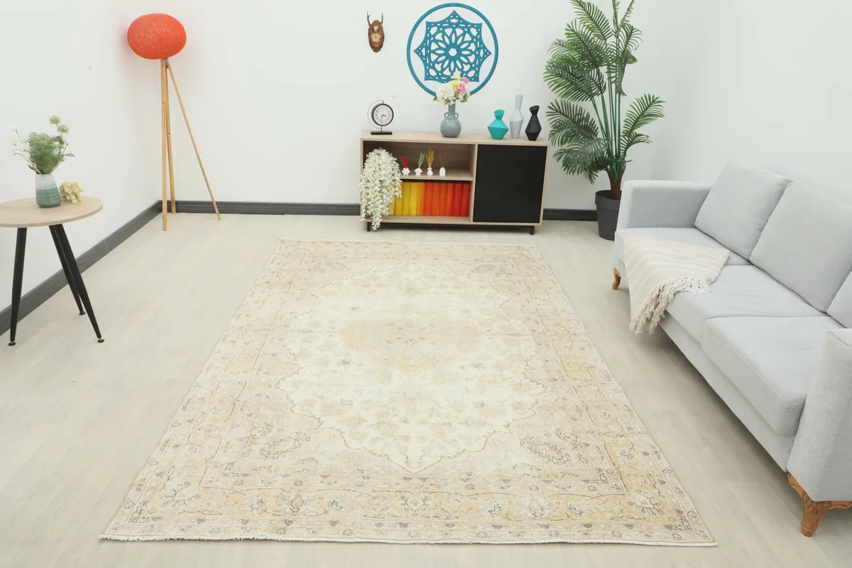 Full room view of the cream and gold vintage Anatolian rug, showcasing its harmonious integration with modern decor.
