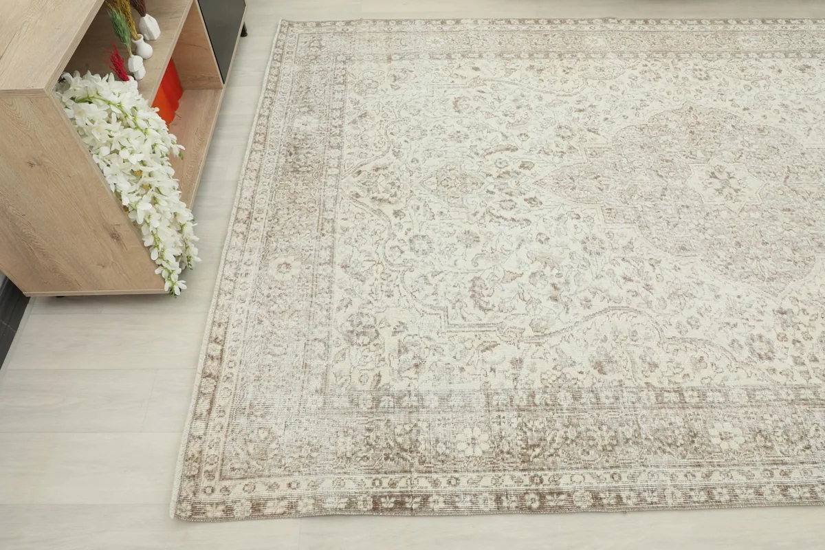 Angled view of the rug's corner, showing the overall pattern and subtle color variations.