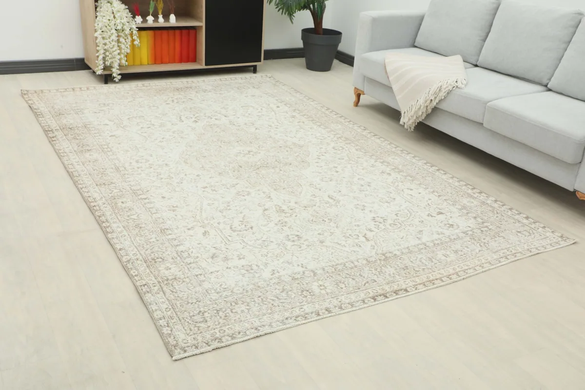 Angled view of the vintage Anatolian rug showcasing its size and placement within a room.