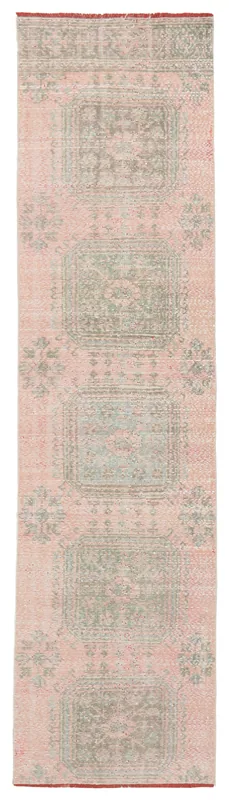 Full top view of the rose and green vintage Anatolian runner rug on a white background.