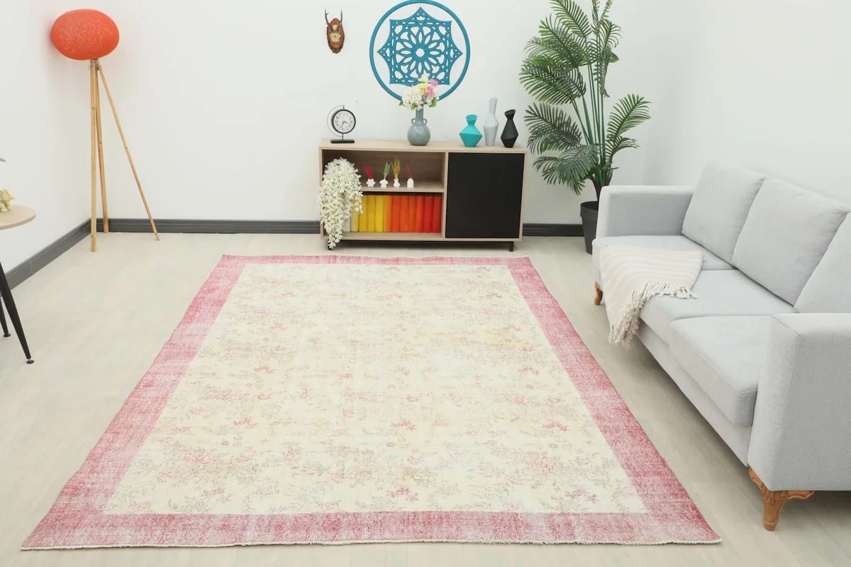 Wide shot of the vintage area rug grounding a modern living room space