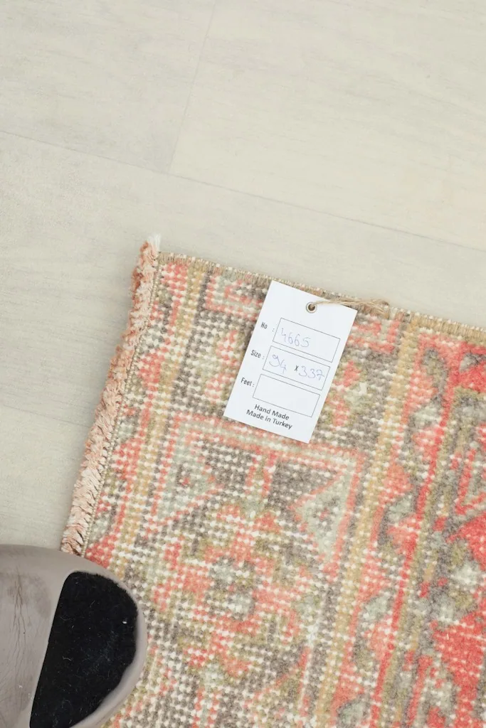 A tag on the rug's corner, indicating its origin and material details.
