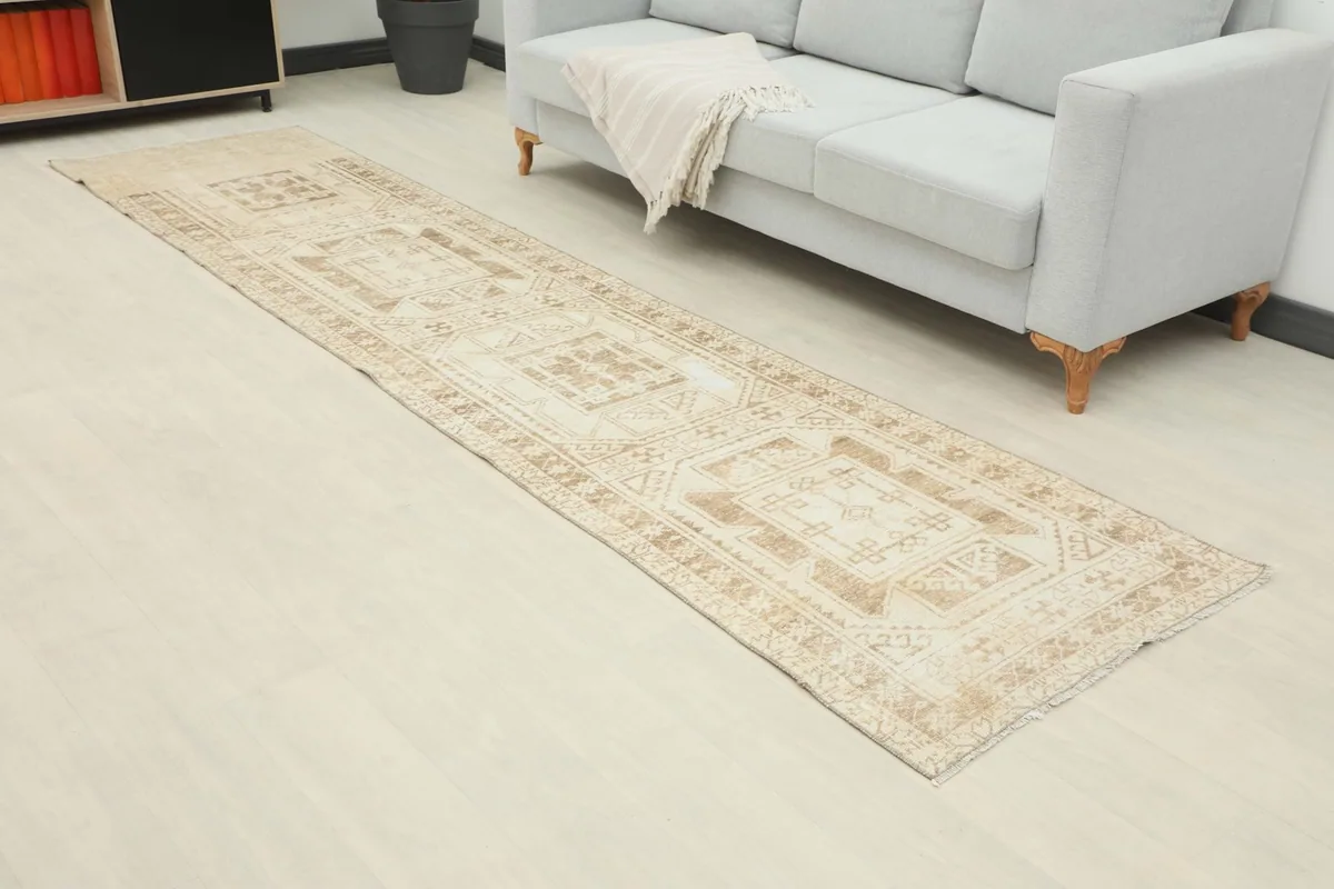 Angle view of the runner rug in a living space, highlighting the geometric patterns and colors.