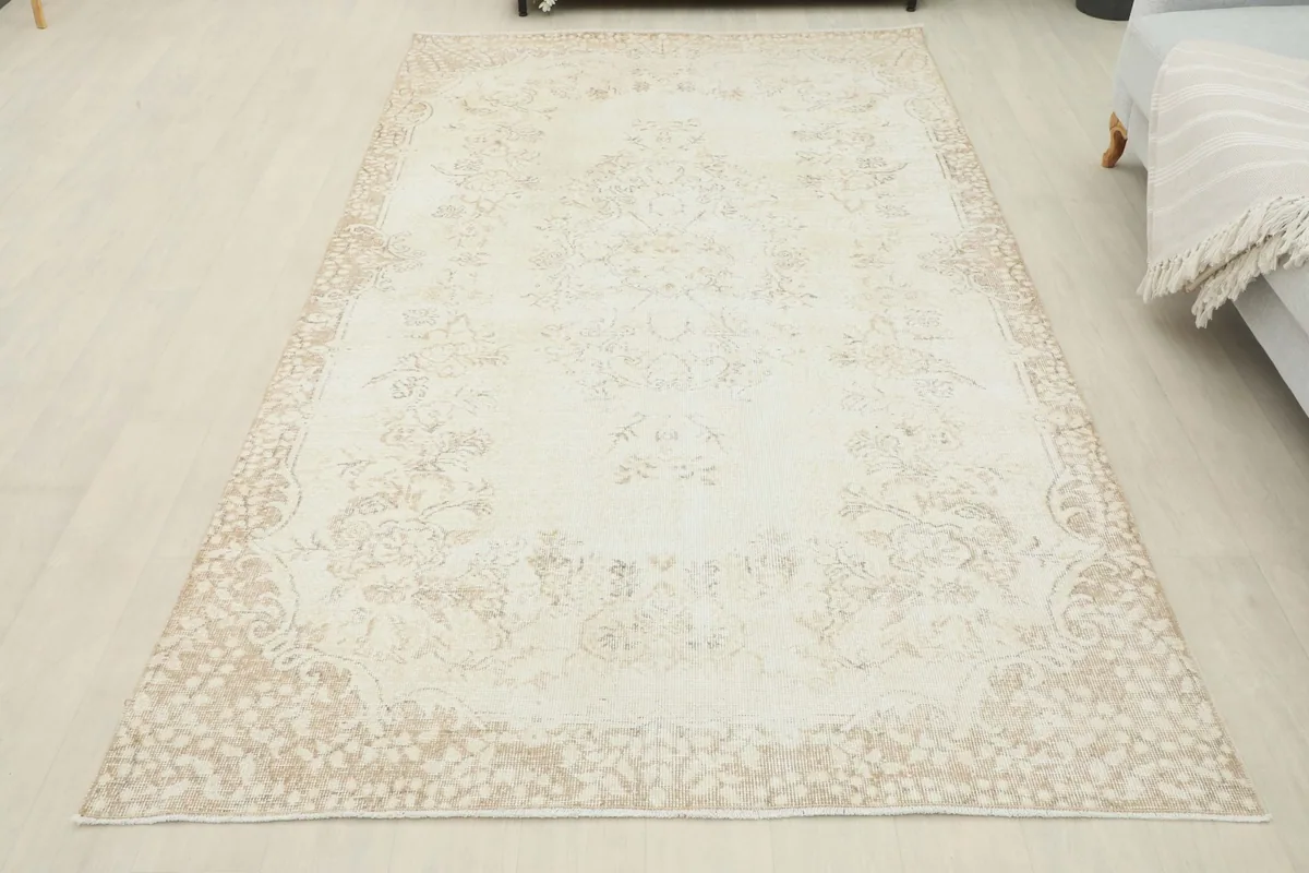 Overhead view of the full rug in a room setting, showing its overall appearance and shape