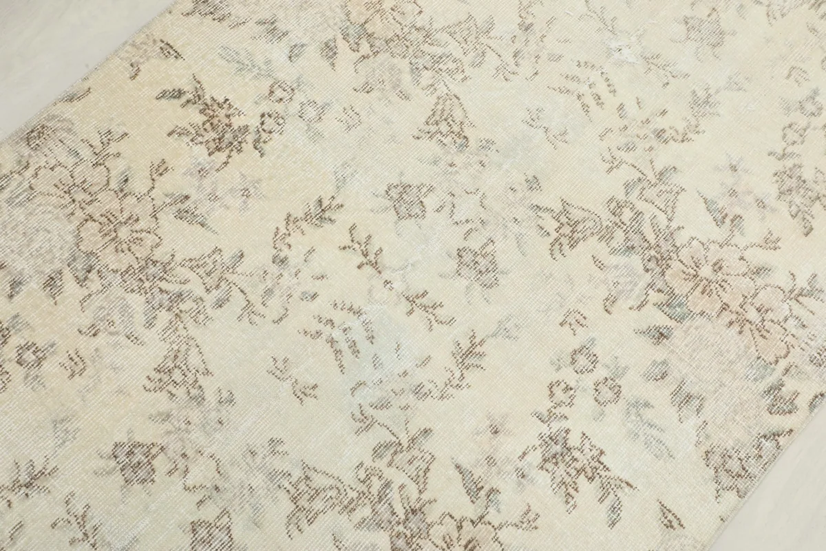 Close-up of the rug's texture and intricate floral design elements