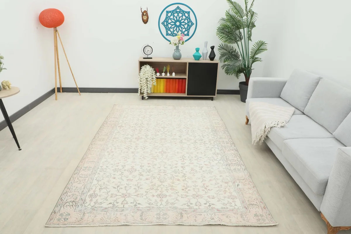 Full room view of the ivory rose floral rug, demonstrating its scale and aesthetic impact