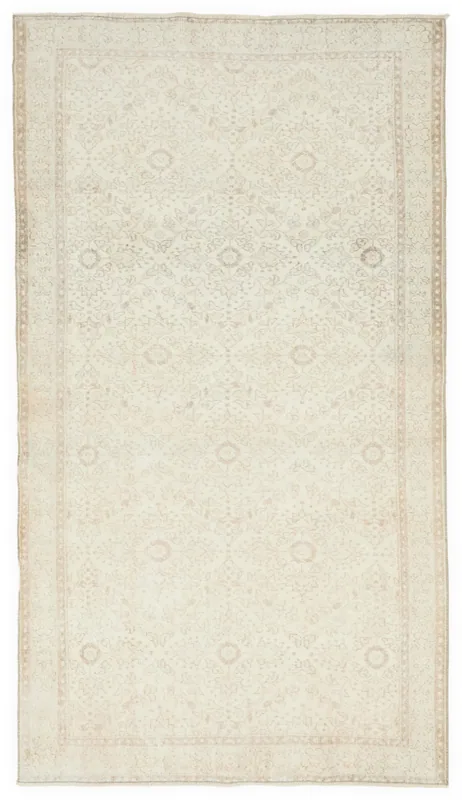 Full overhead view of the 5'0" x 8'11" cream Anatolian vintage rug on a white background.