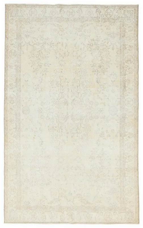 Full top view of the 5'3" x 8'6" ivory and beige vintage Anatolian area rug on a white background