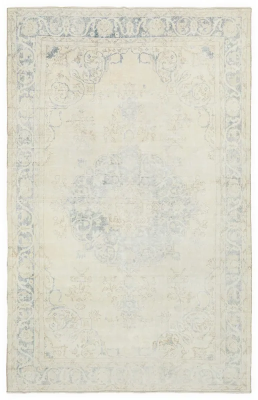 Full top view of the ivory and blue vintage Anatolian area rug on a white background.